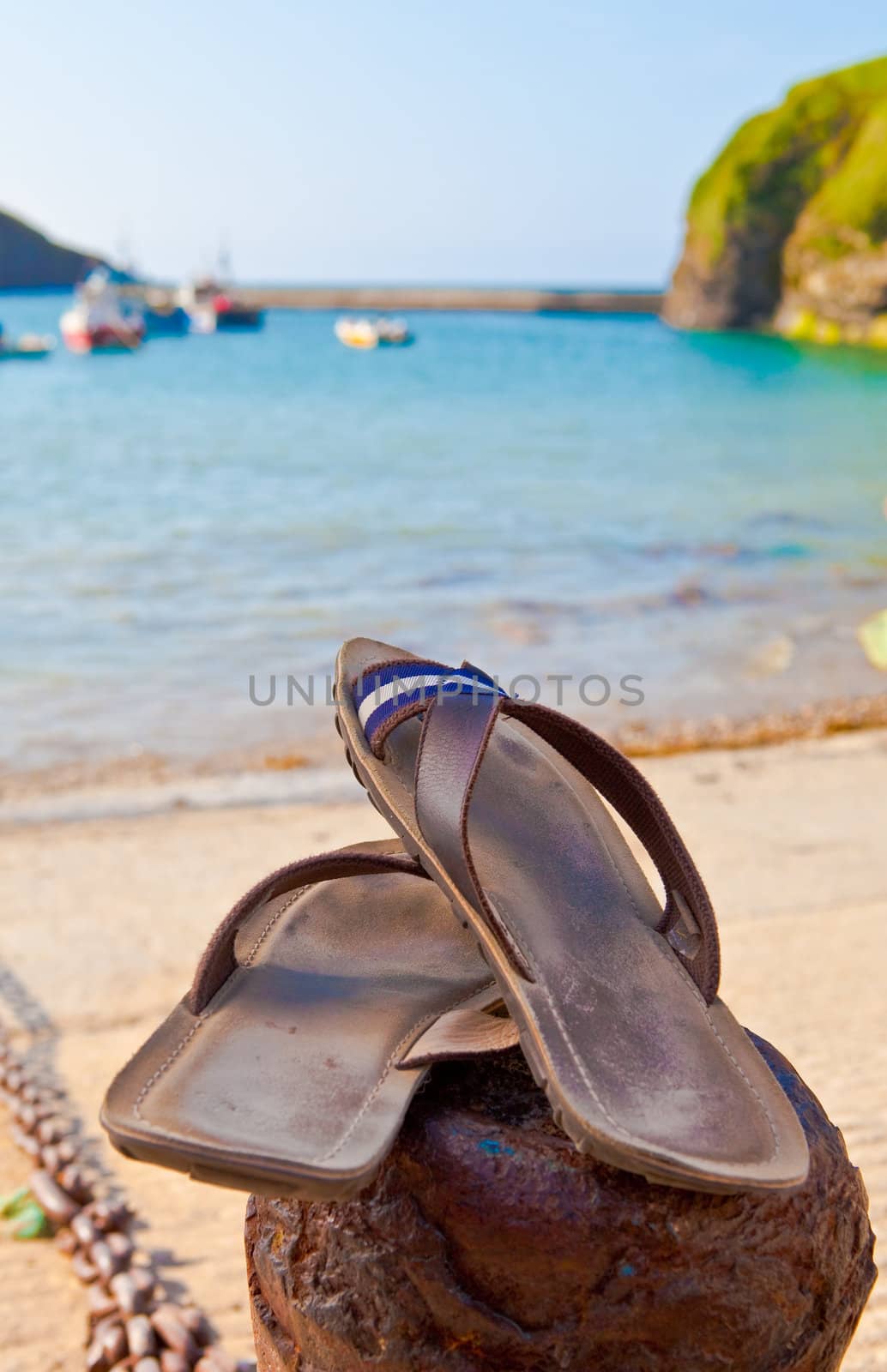 Summer concept, sandals by the beach by trgowanlock