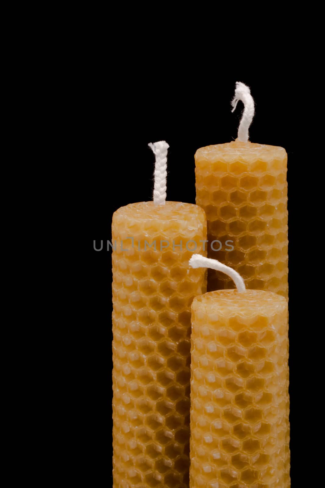 three besswax candles