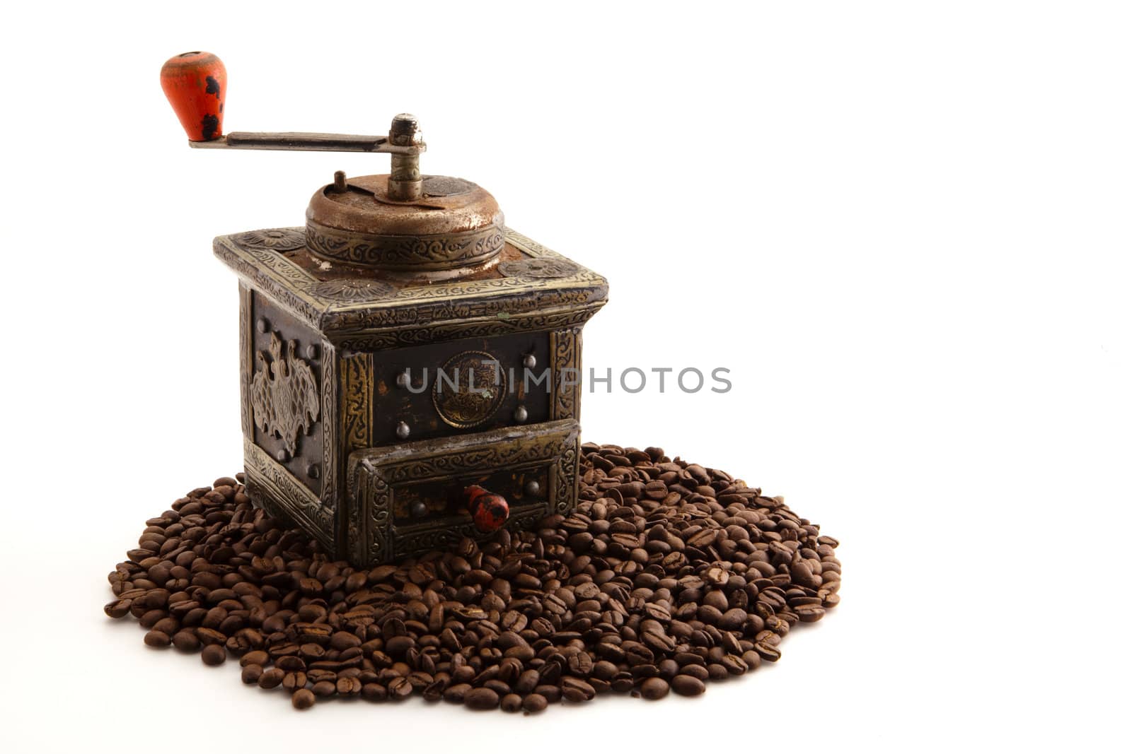 antique coffee grinder on white