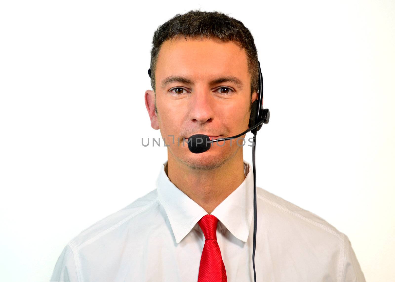 Good looking young man with headset isolated on white background