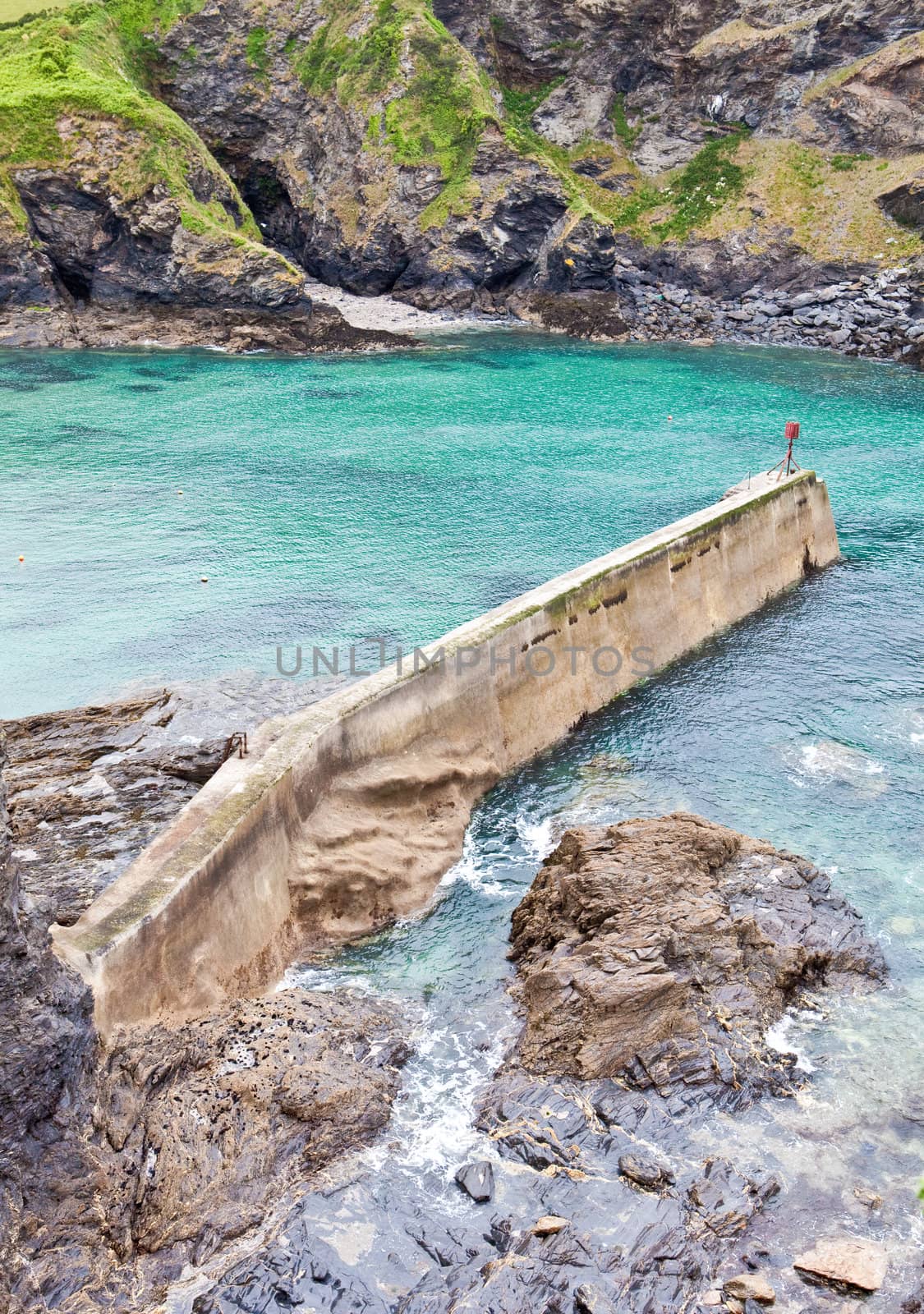 Vibrant detailed image of an old stone pier in Port Isaac, Cornw by trgowanlock