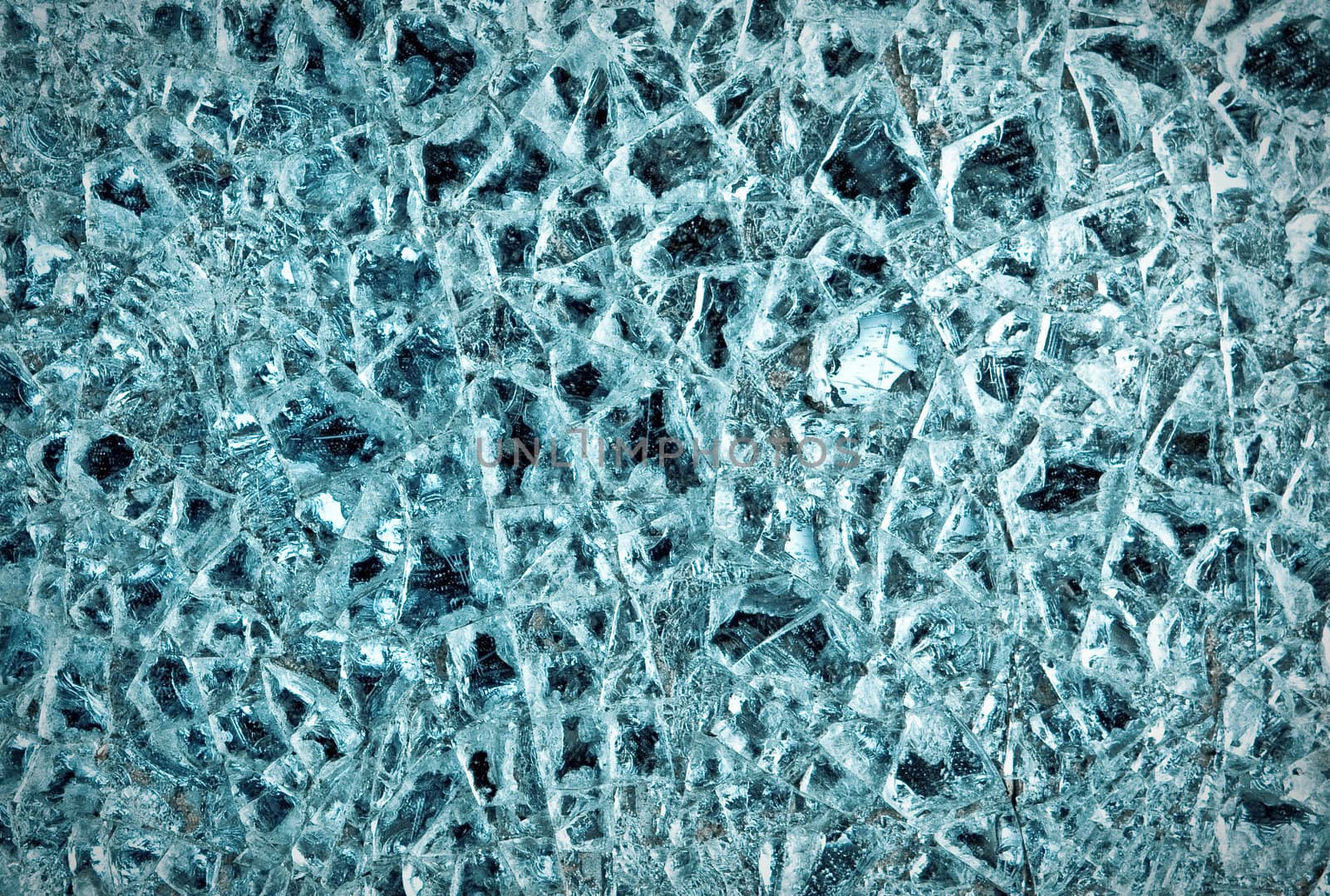 A dramatic shattered glass background in cold tones