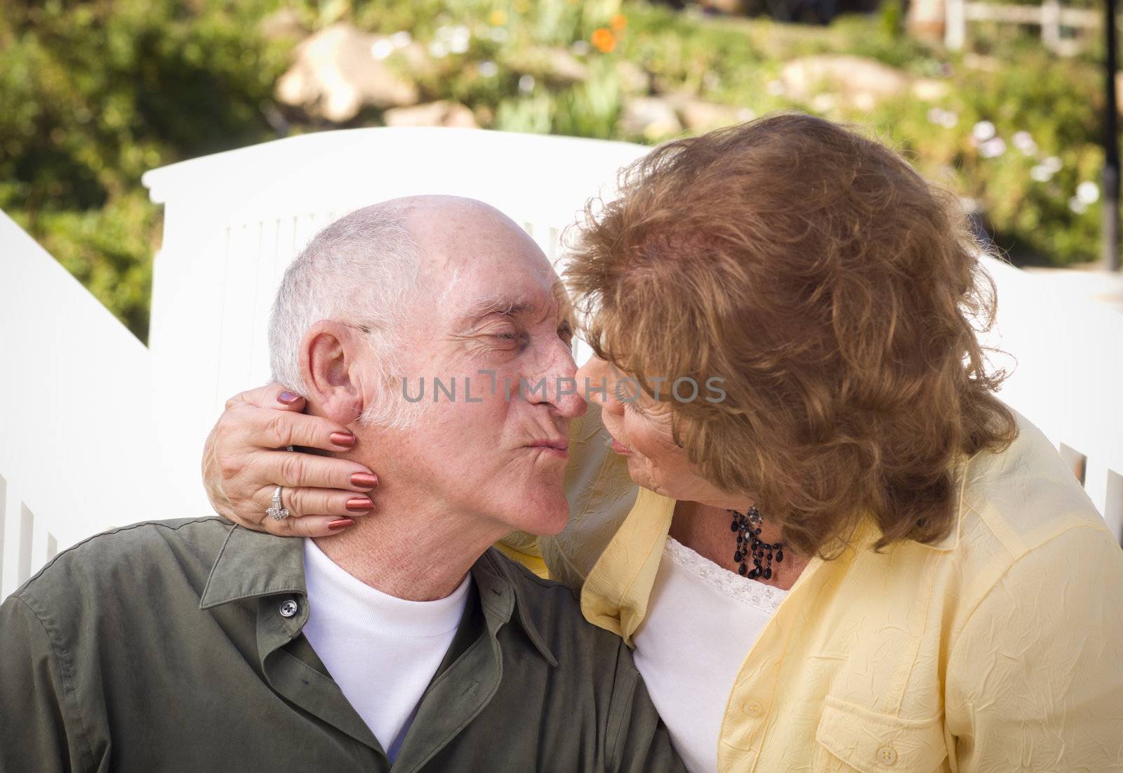 Senior Couple Kissing in the Park by Feverpitched