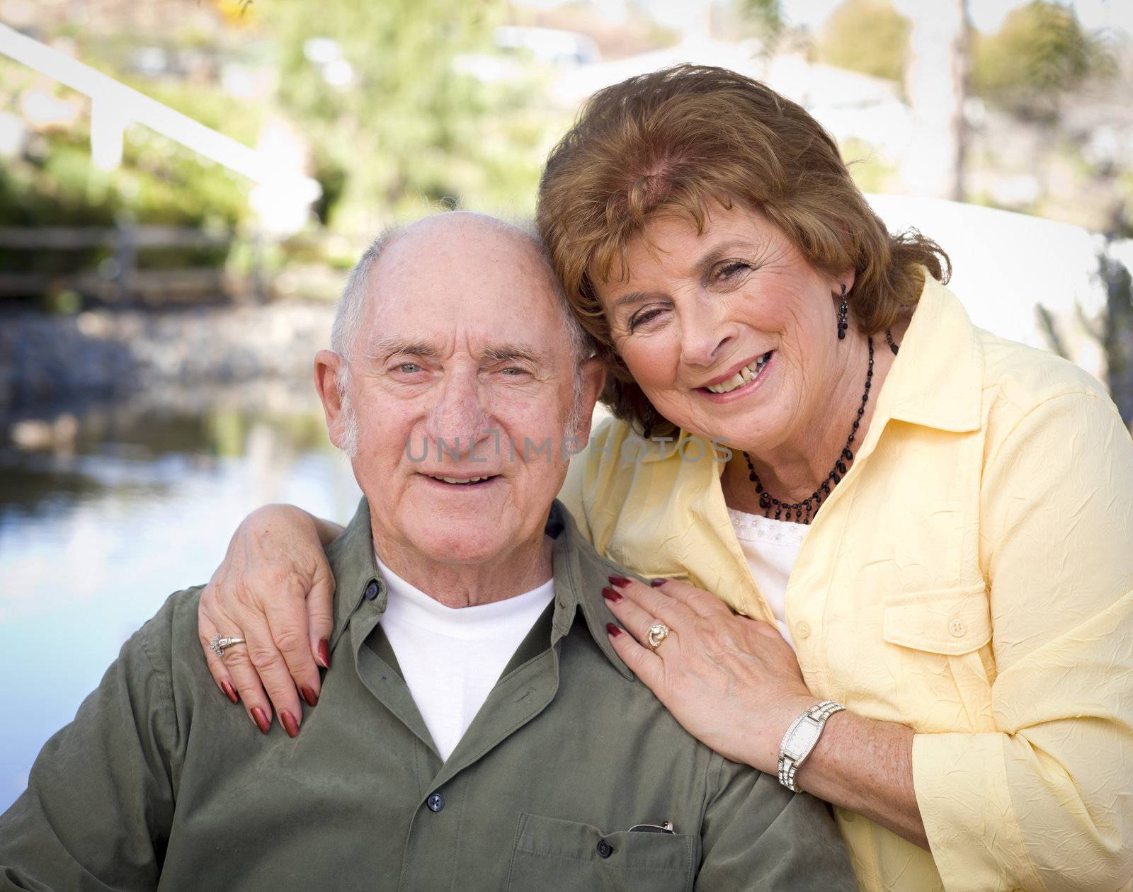 Happy Senior Couple Relaxing in The Park by Feverpitched