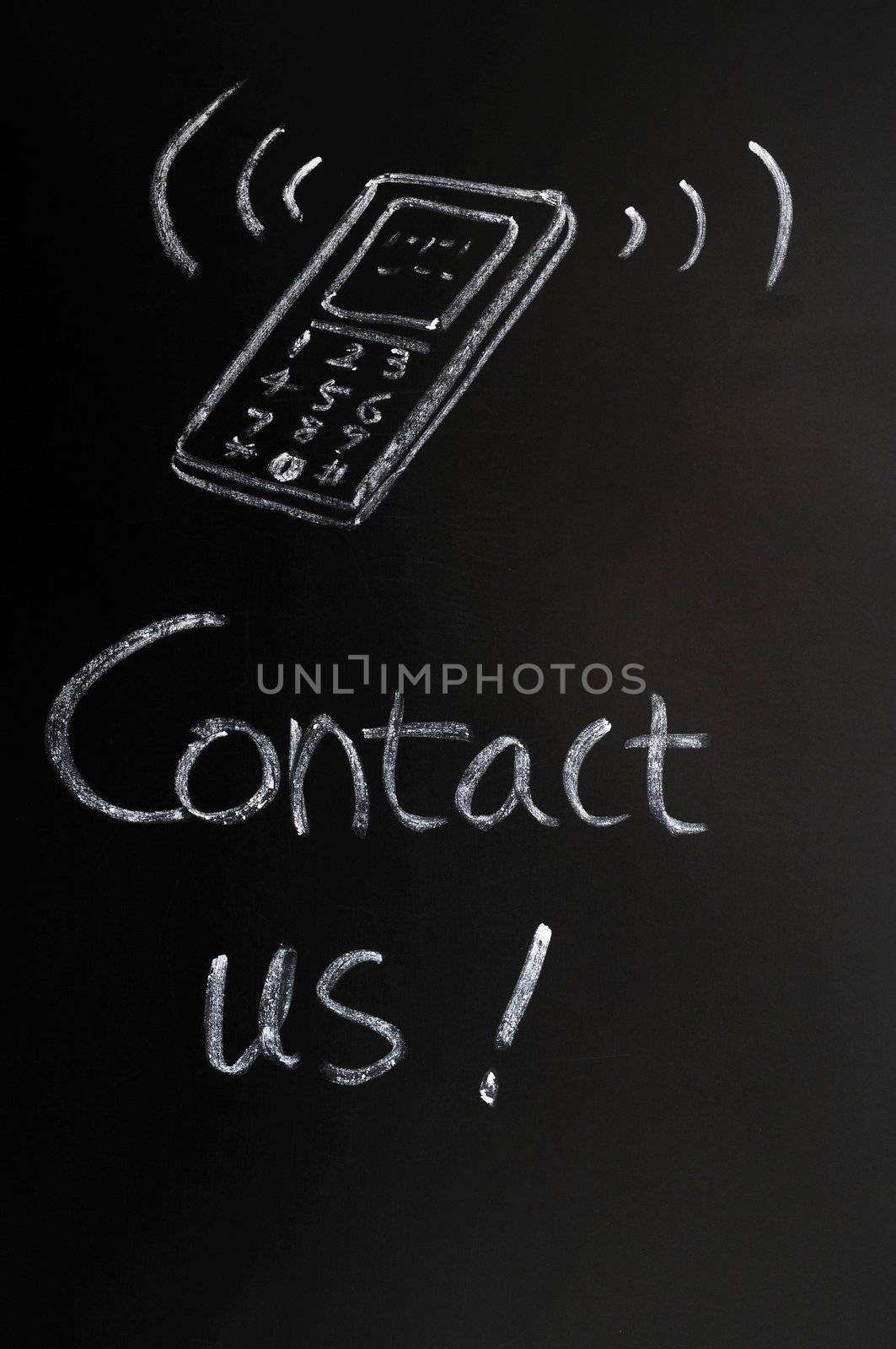 Contact us - text written in chalk on a blackboard