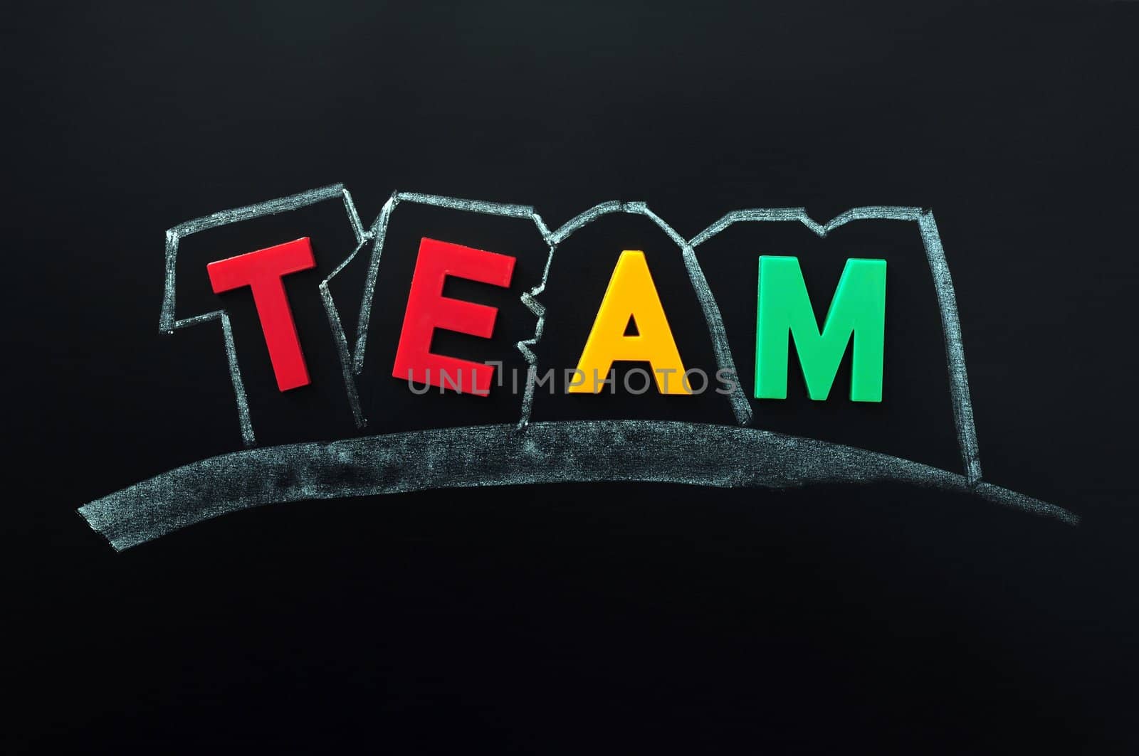 Team -  word made of colorful letters on a blackboard