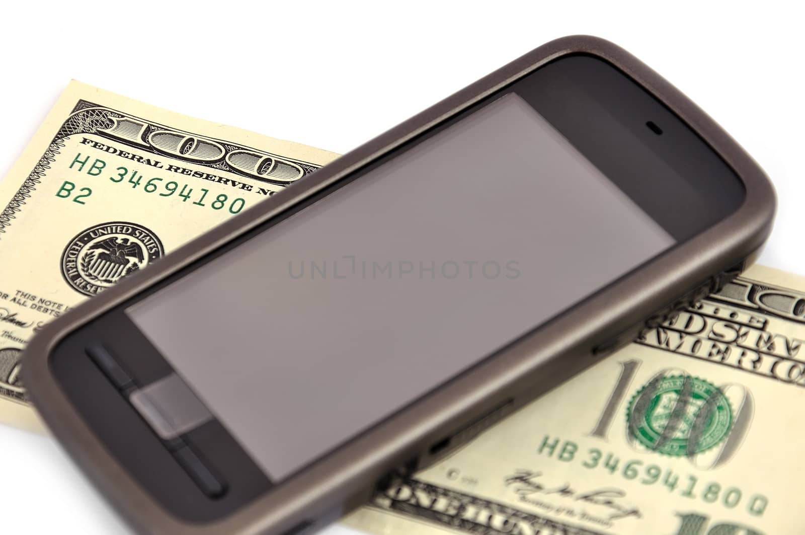 touchscreen mobile phone and dollar on white background