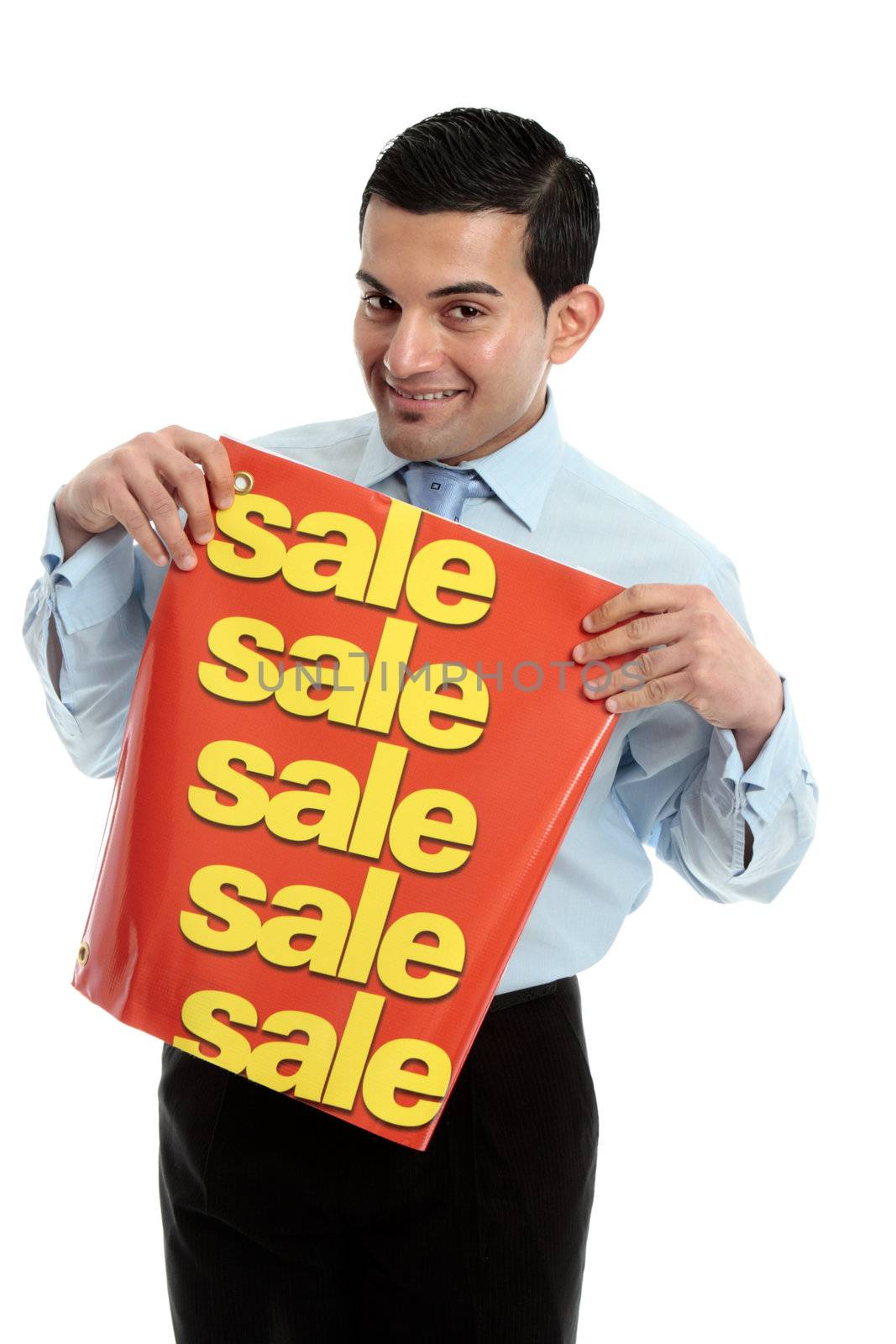 A happy and friendly smiling retail salesman holding a sale sign banner.  White background.