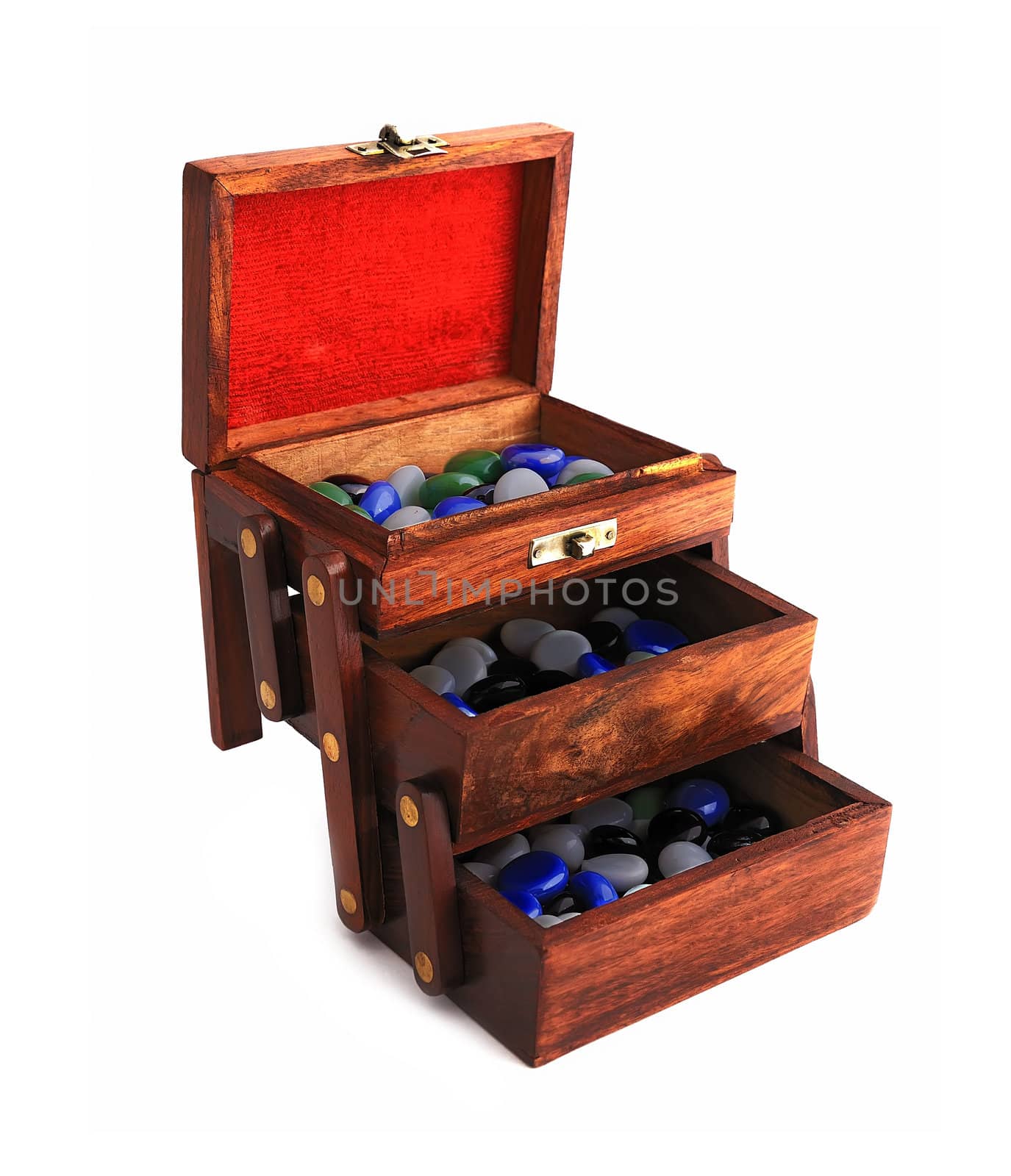wooden box with colored stones on a white background