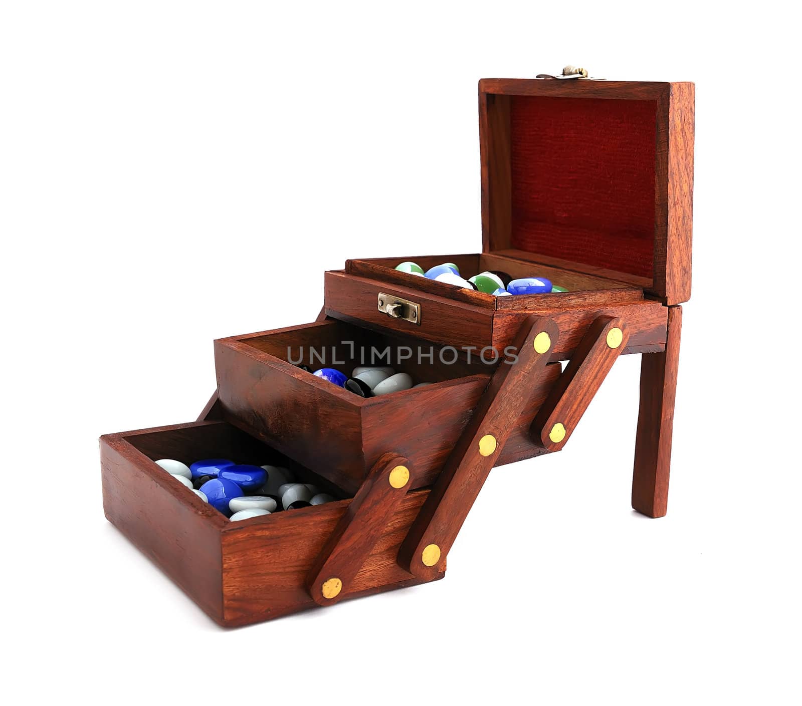 wooden box with colored stones on a white background