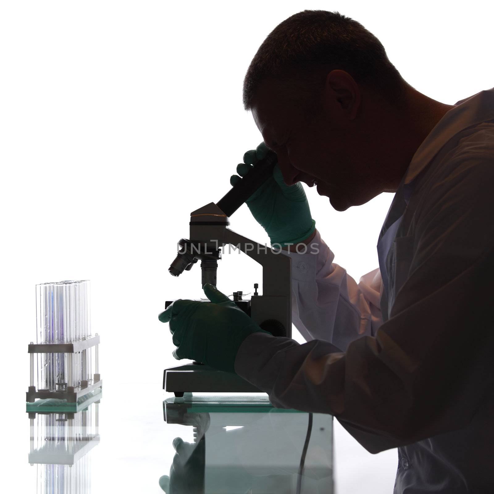 Scientist looking into a microscope in a laboratory