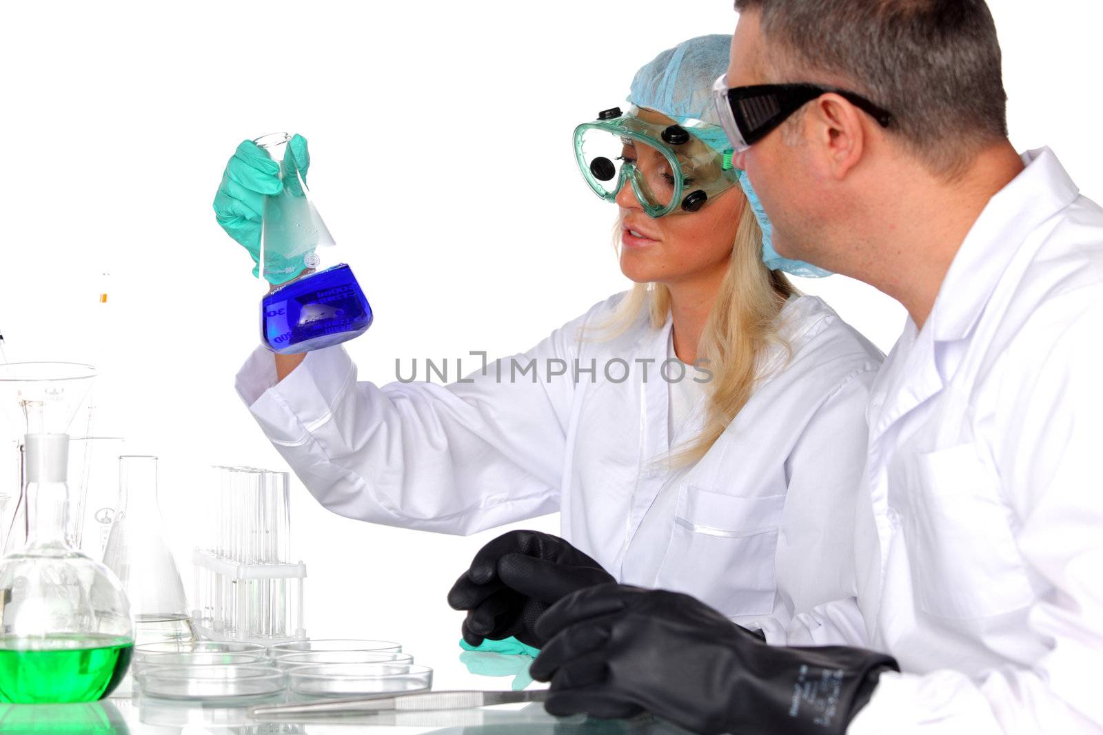  researchers holding a secret green chemical substance