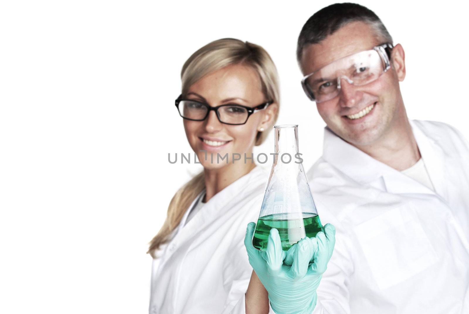  researchers holding a secret green chemical substance