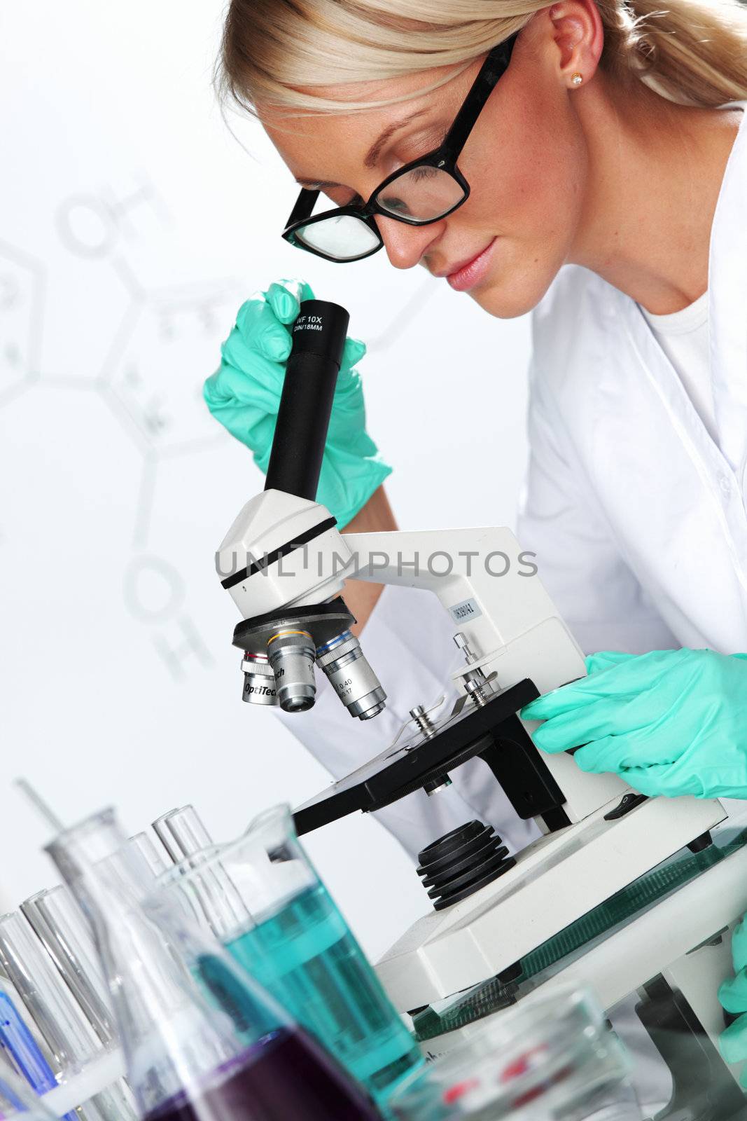 woman scientist in chemical lab by Yellowj