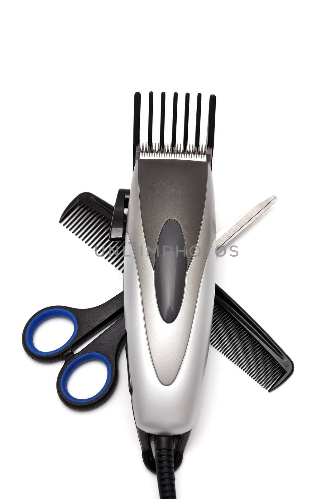 hair clipper, comb and scissors   on white background
