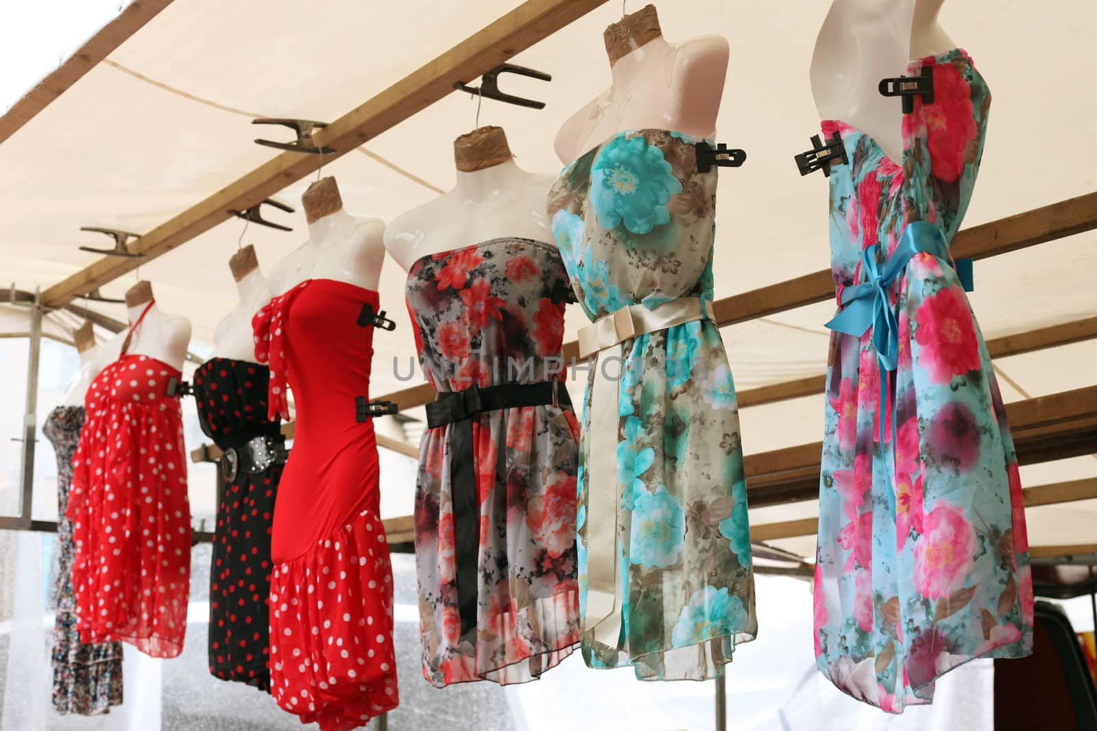 Row of clourfull summerdresses  by ahavelaar