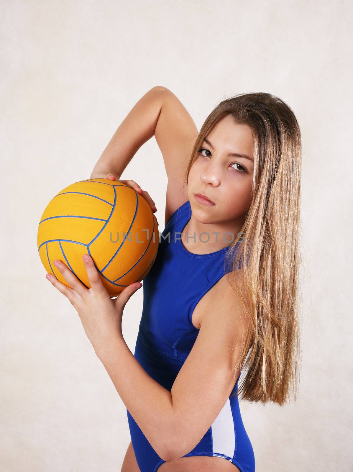 The girl - teenager in a water ball in studio