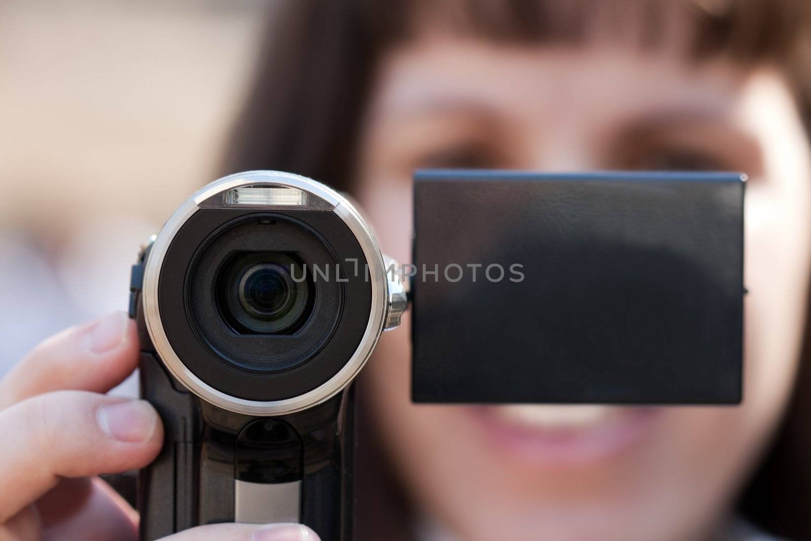 Human home video - adult women holding lens camera