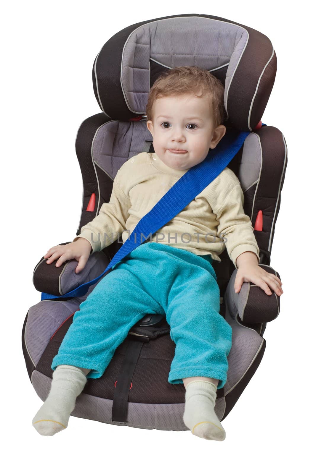 Little child on vehicle car safety seat with belt
