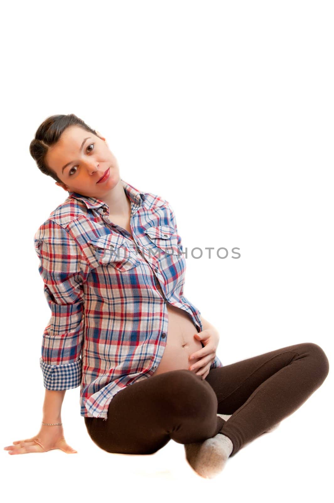 Isolated pregnant girl portrait sitting on white