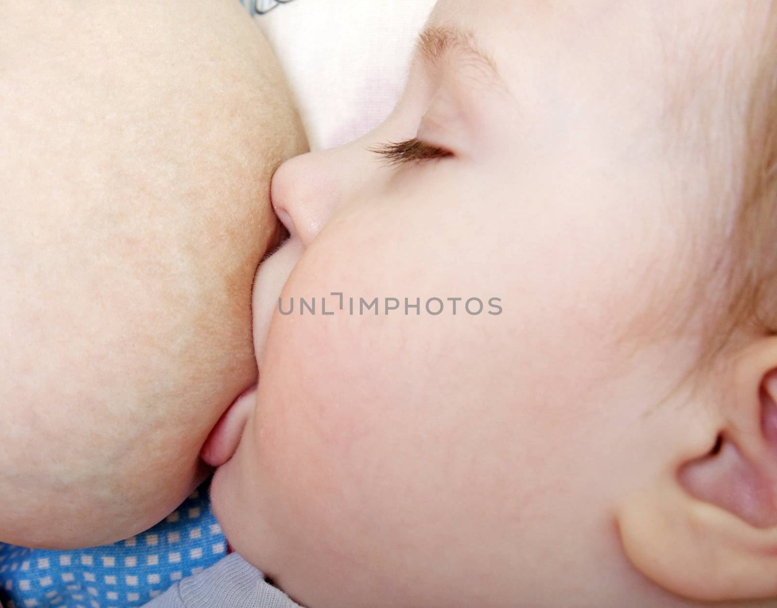 Baby breastfeeding by ia_64