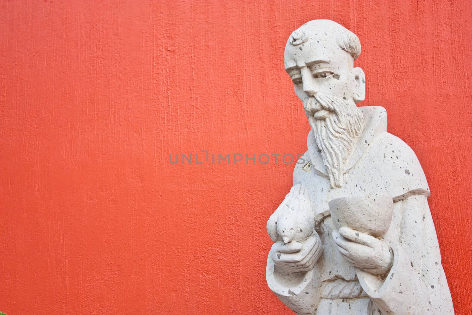 Saint Francis statue at the entrance of a Mexican church