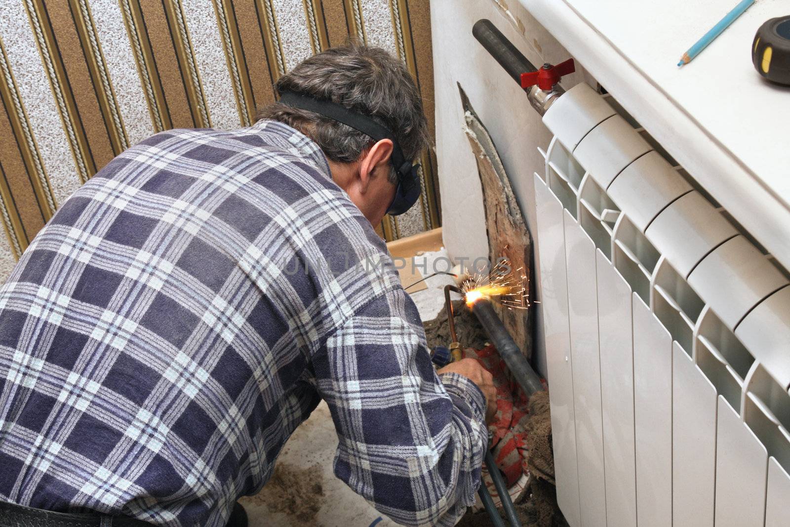 Installing new radiators with gas welding