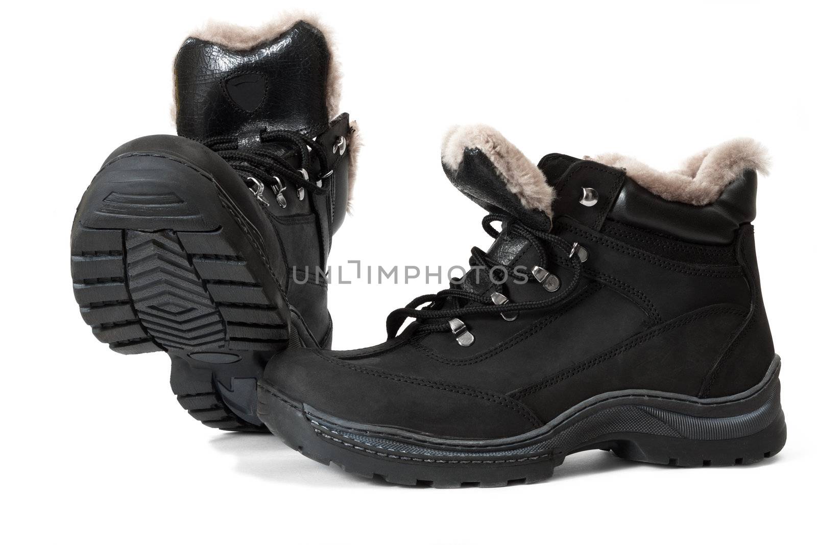 Black winter man's boots on a white background