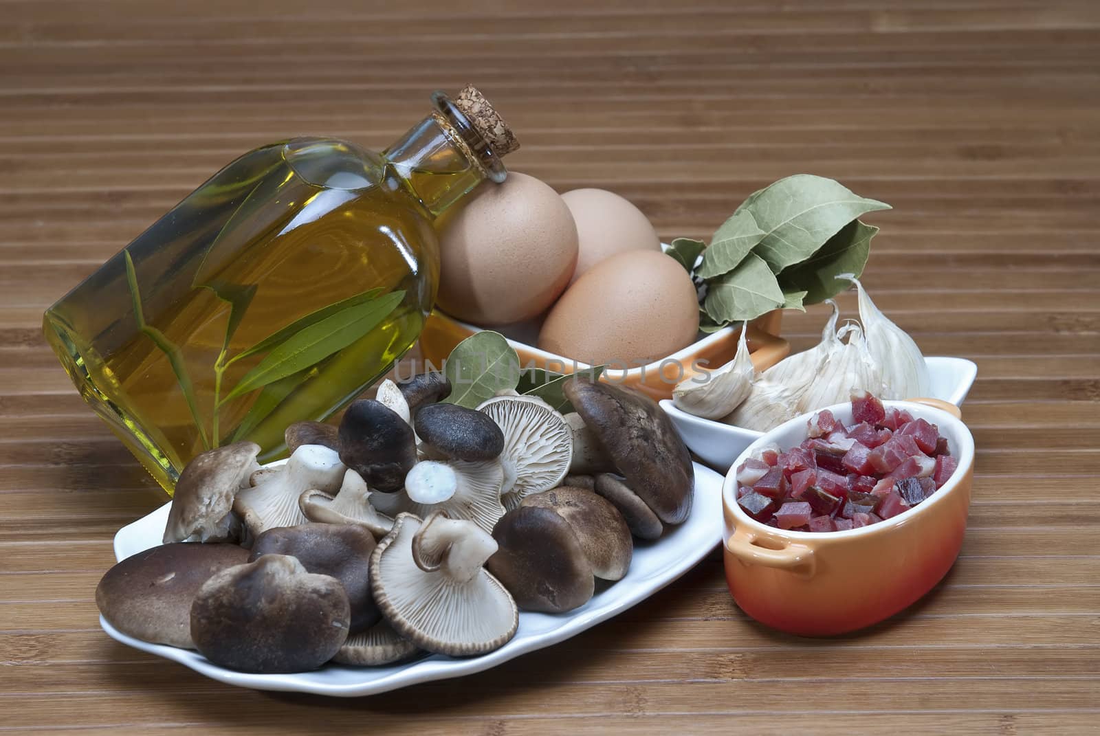 Mushrooms, eggs, ham and olive oil to cook. by angelsimon