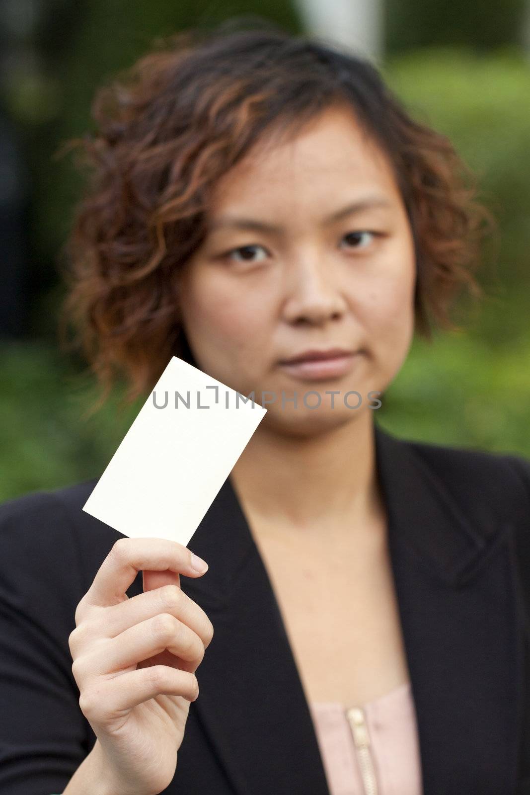 Business woman holding a name card