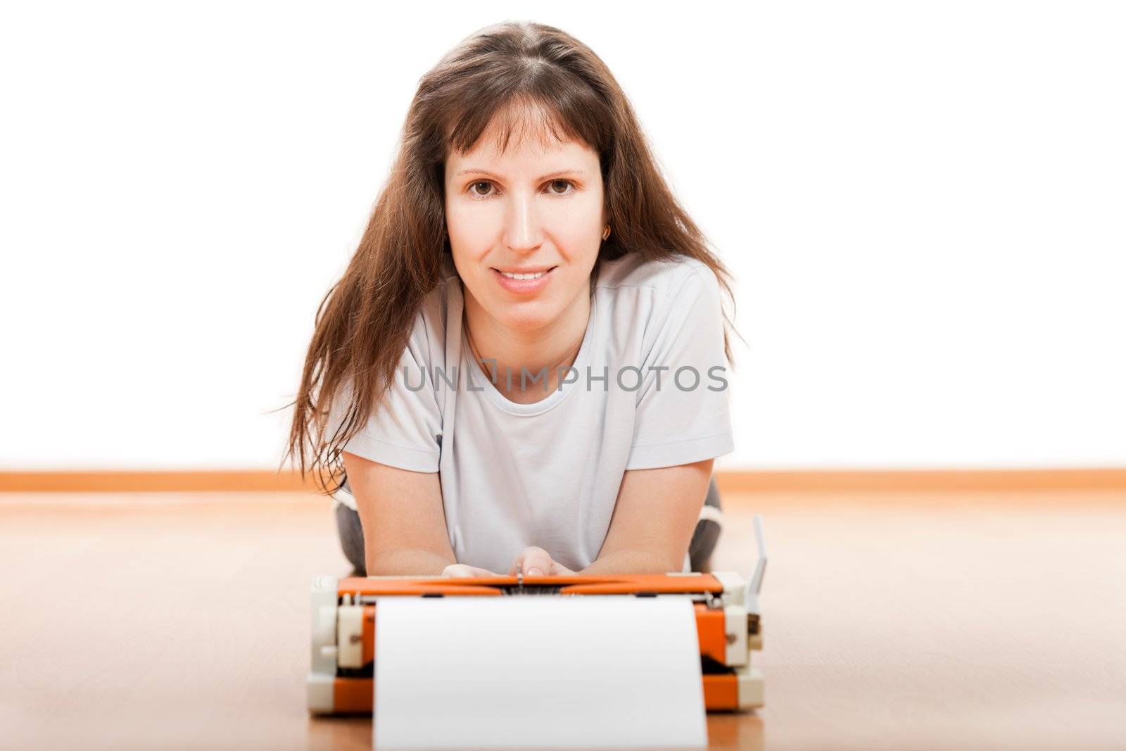 Smiling women typewriter typing blank paper text