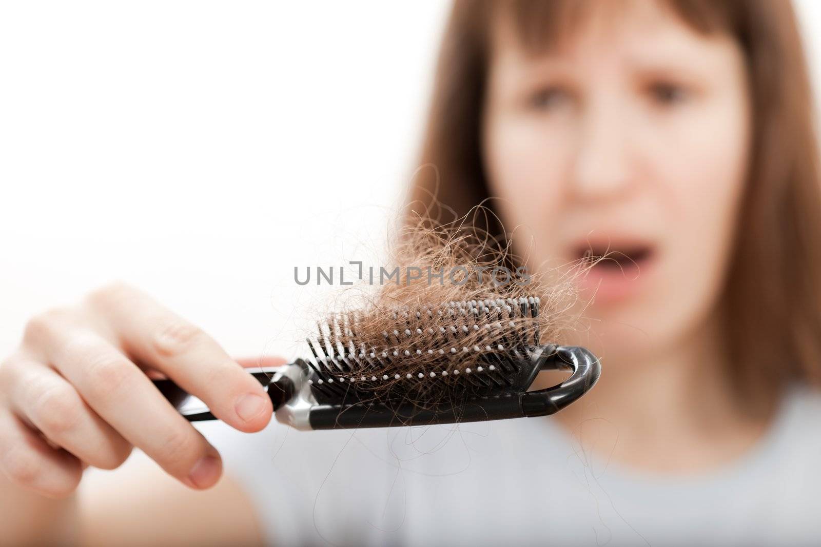 Balding problem women hand holding loss hair comb