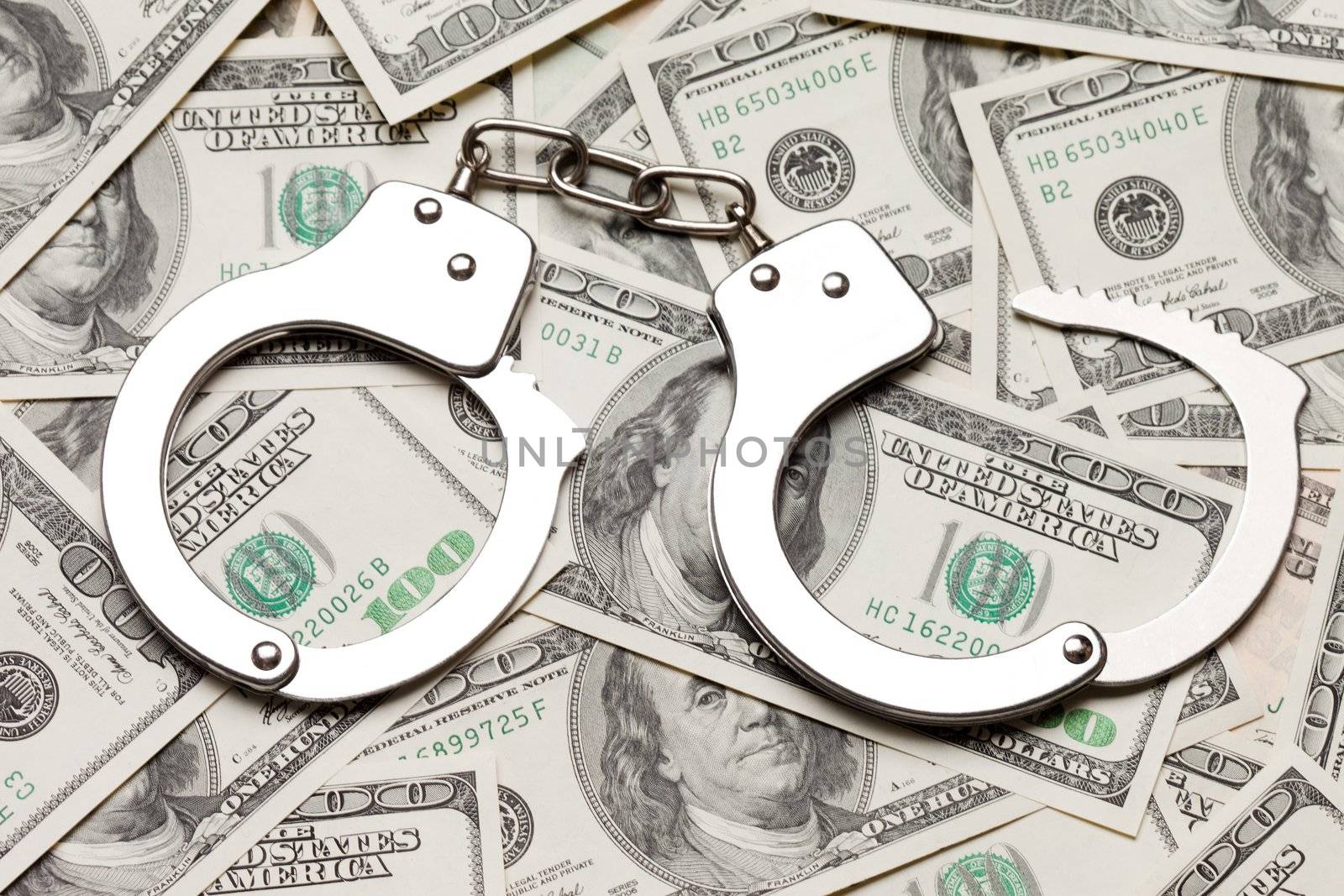 Crime law handcuffs arrests paper dollars currency