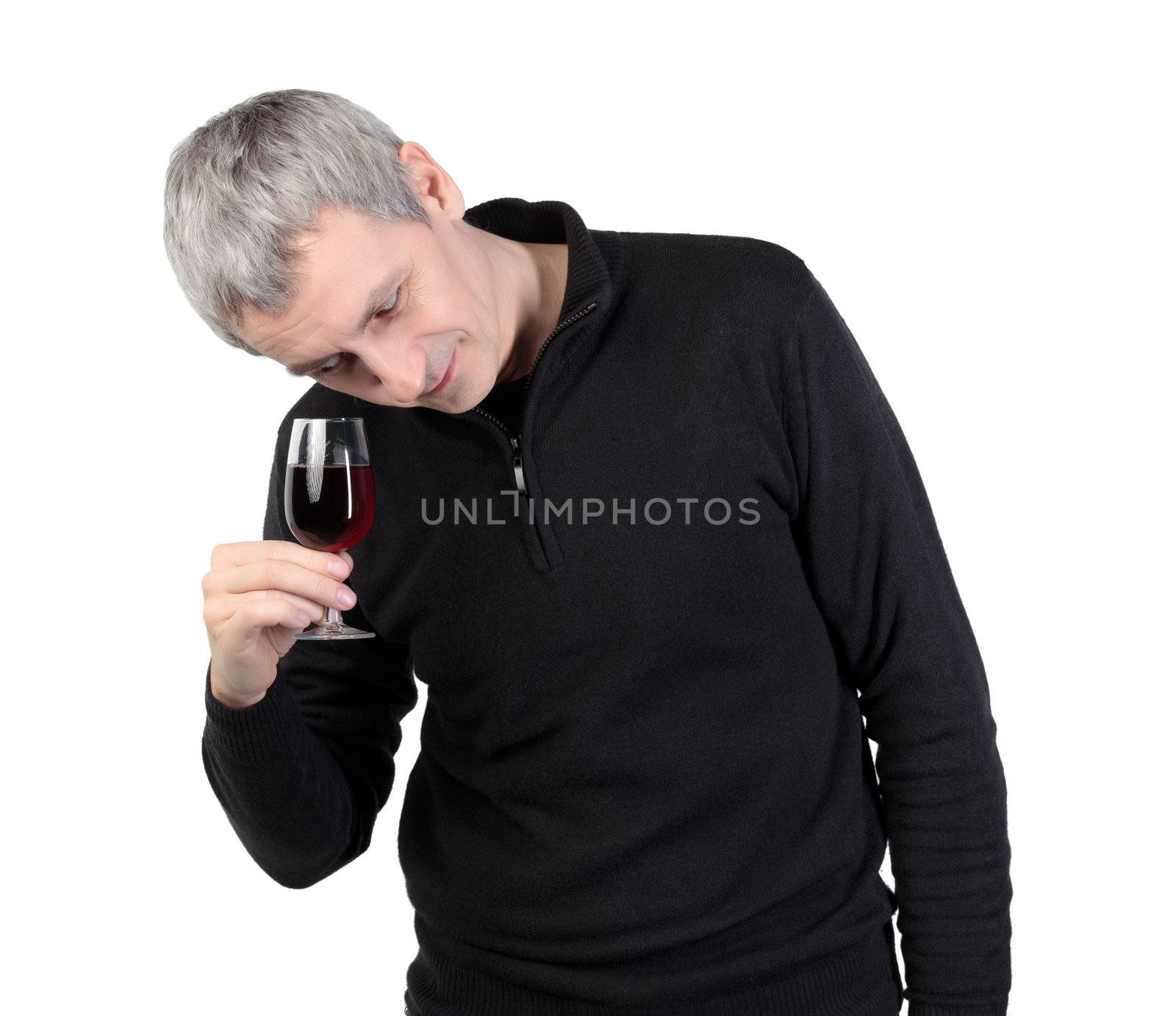 Man looks at a glass of red port wine, on white background