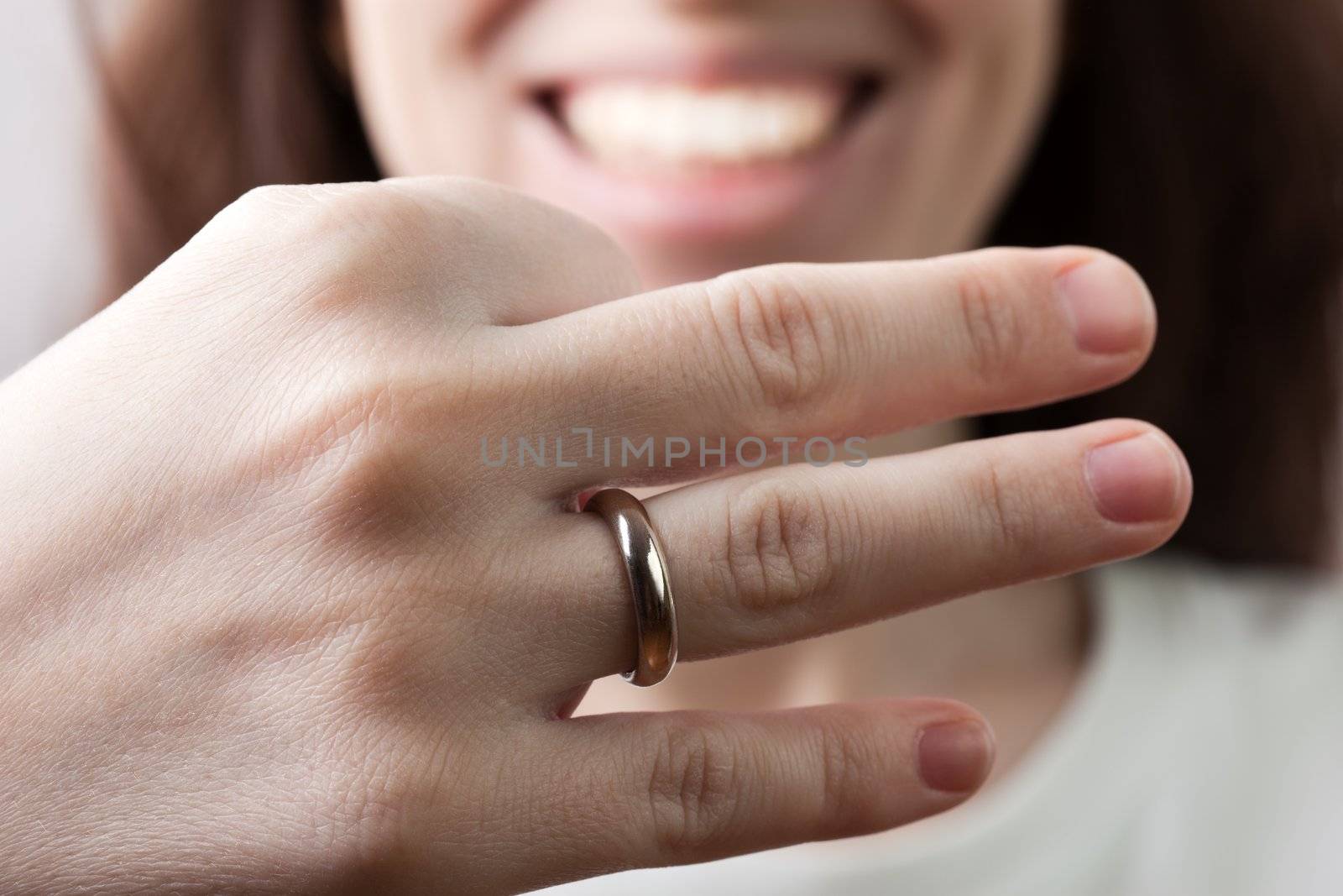 Wedding ring on women finger by ia_64