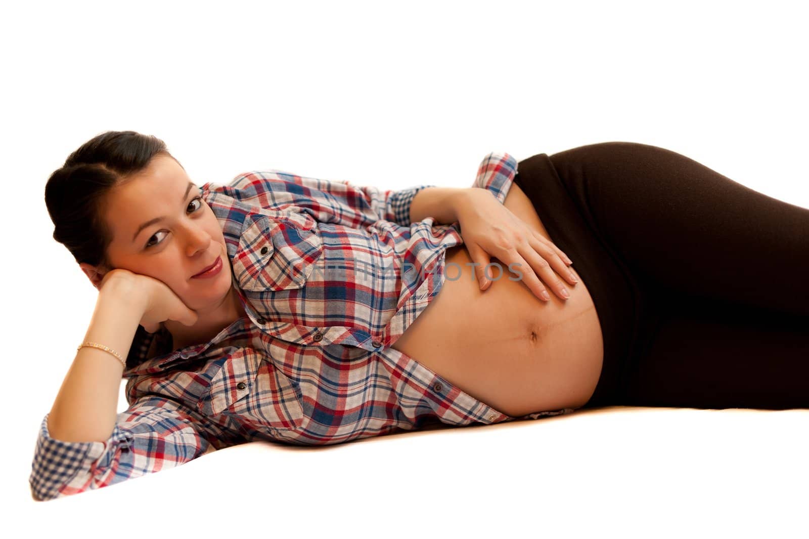 Isolated pregnant girl portrait laying on white