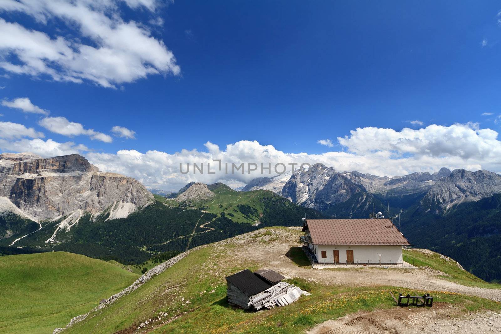 summer view of Italian Dolomites in Fassa valley with Mamolada and Saas Pordoi mountain