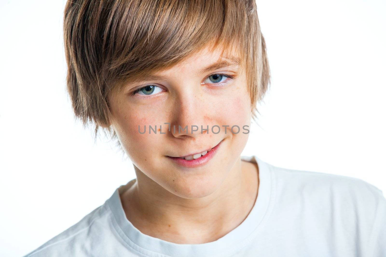 Close up portrait of young smiling cute teenager in white, isolated on white