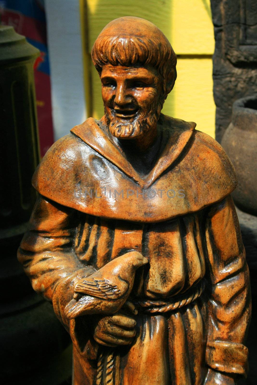Close up of a statue of a priest.
