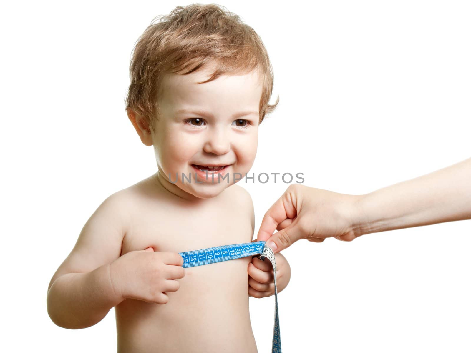 Measure tape in hand measuring human child chest