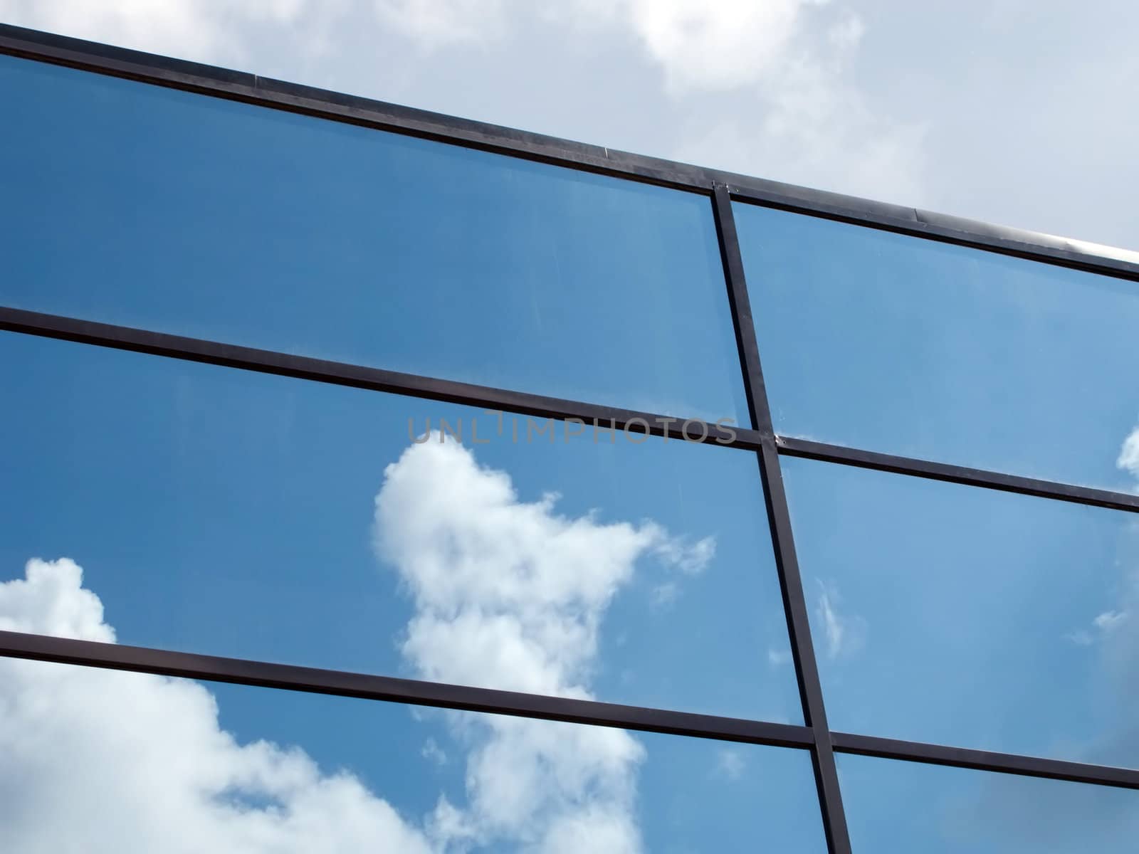 Blue sky and cloud reflection in building outdoors