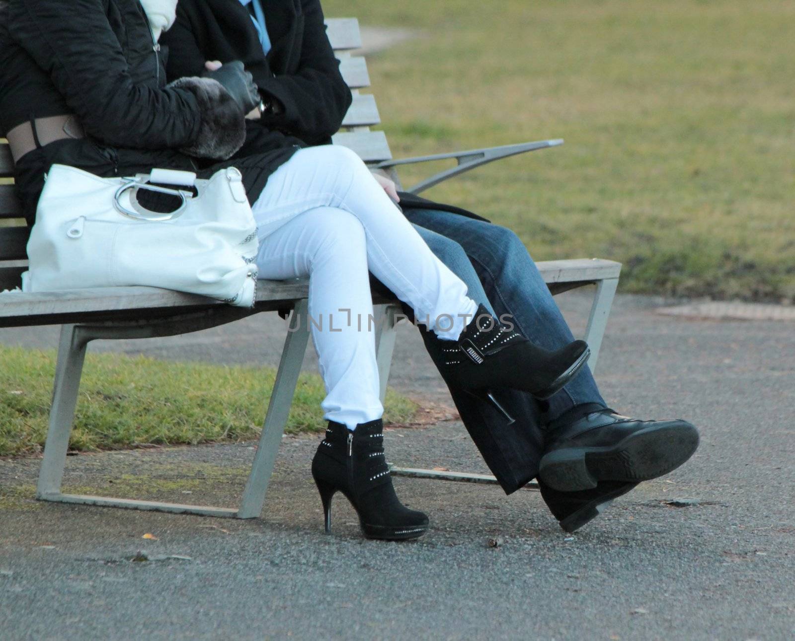 Lovers sitting on a bench in a park