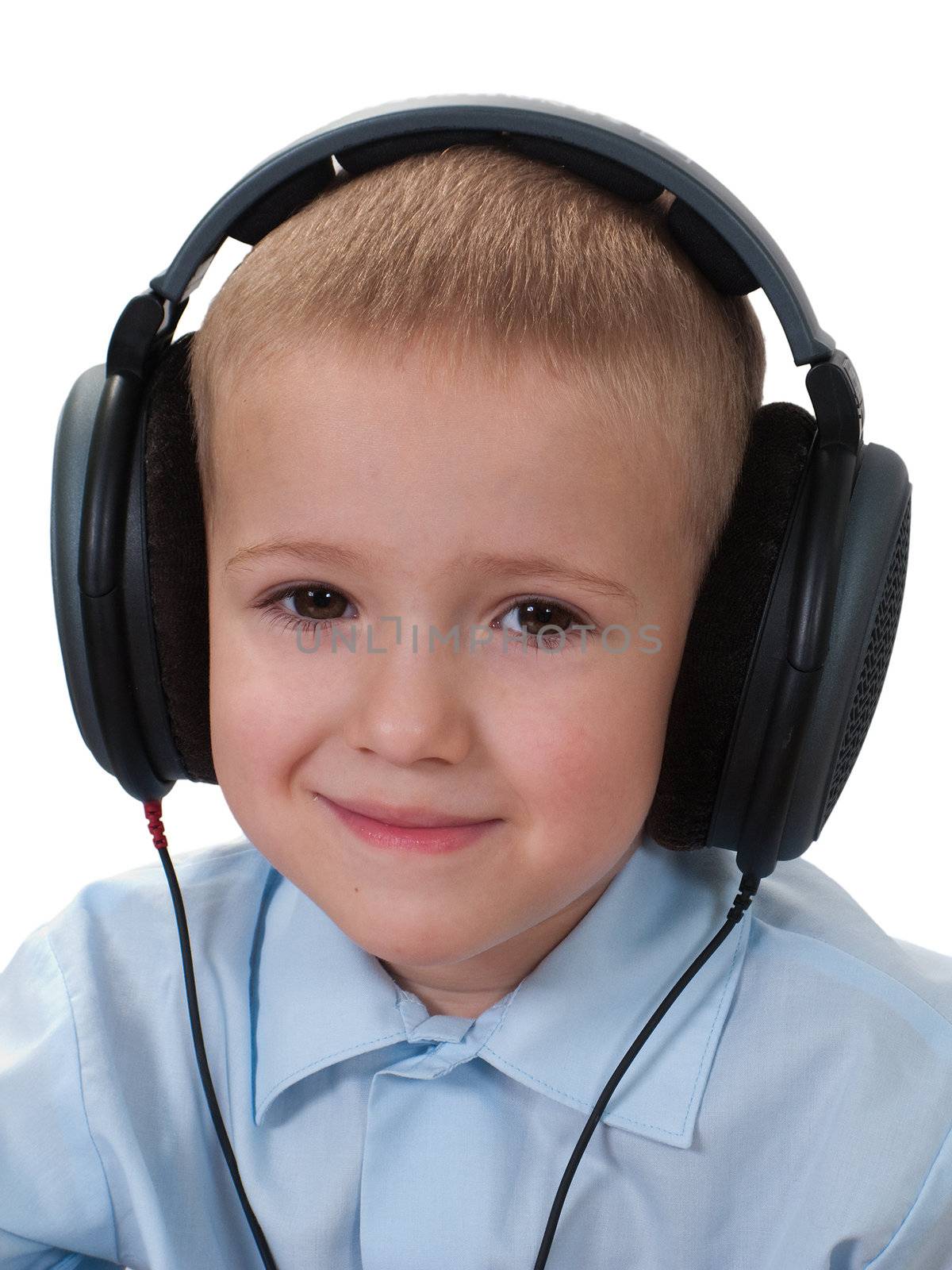 Little child in sound headphones listening music