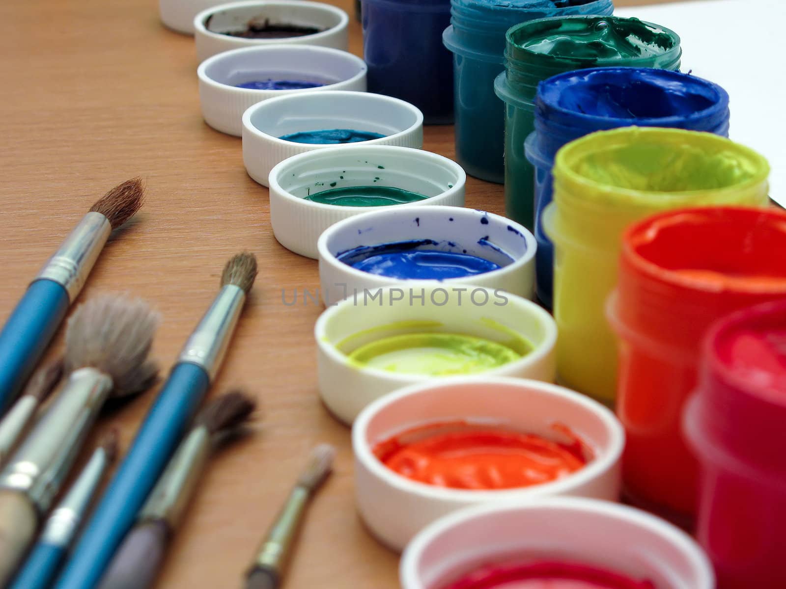 Brushes and paints on table