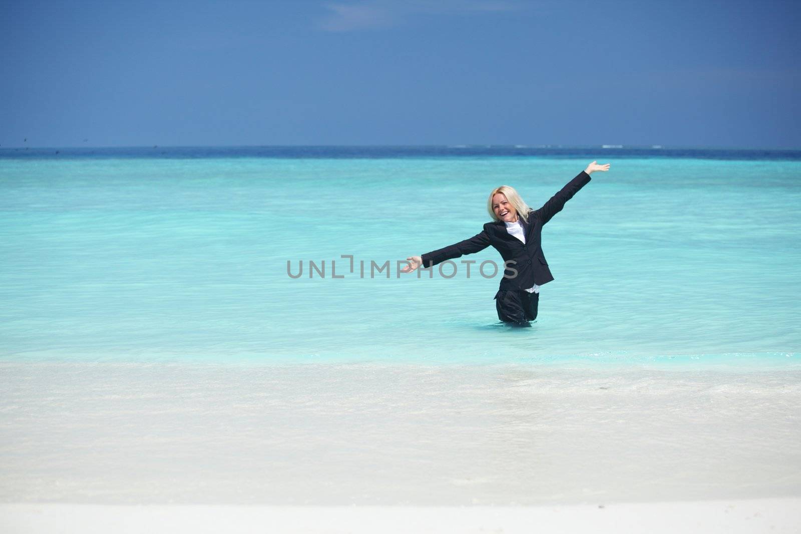 business woman stay in ocean waves