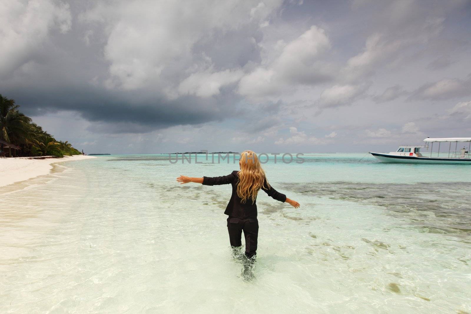 happy  business woman on the desolate ocean coast