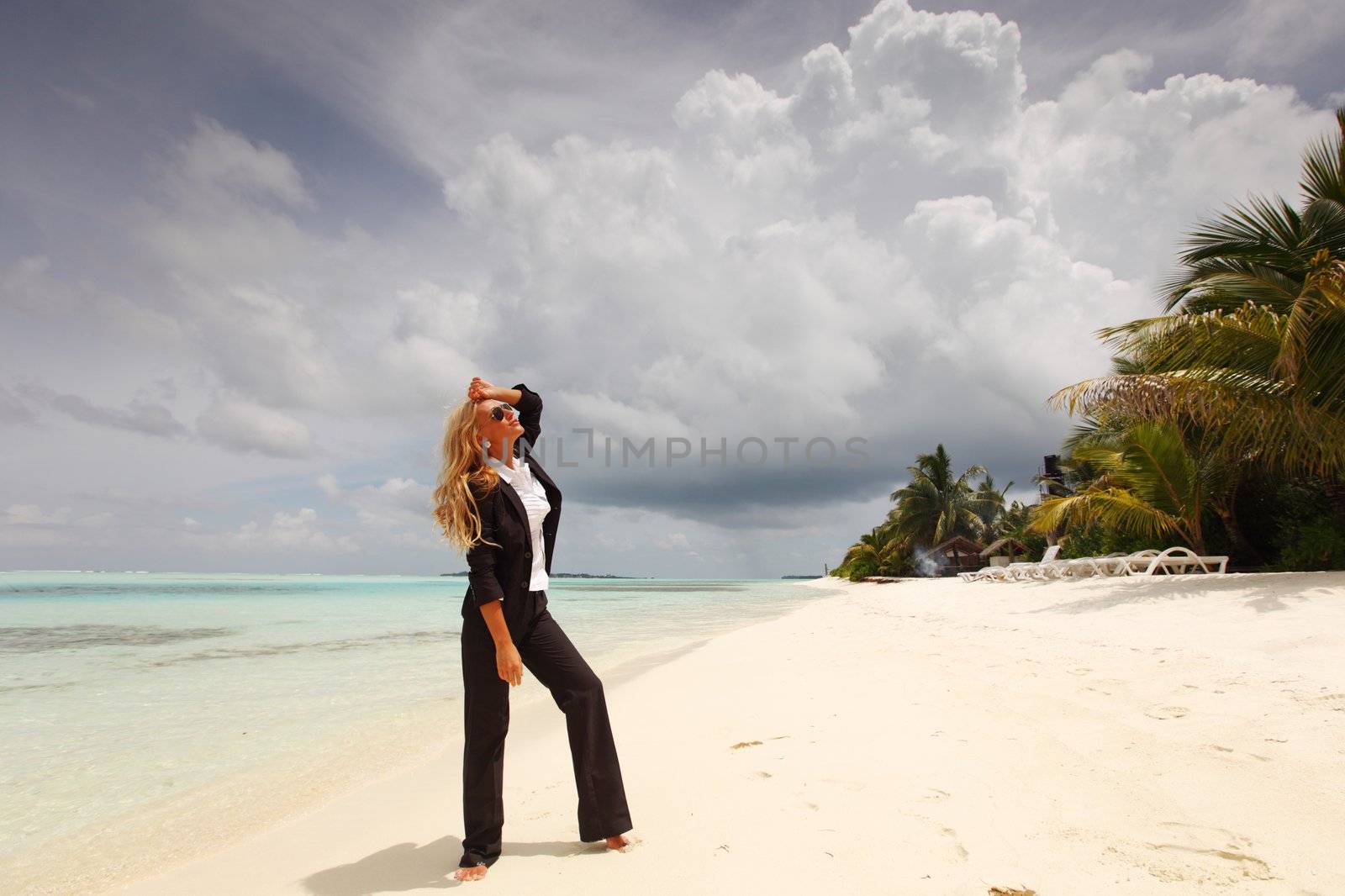 happy business woman on the ocean coast by Yellowj