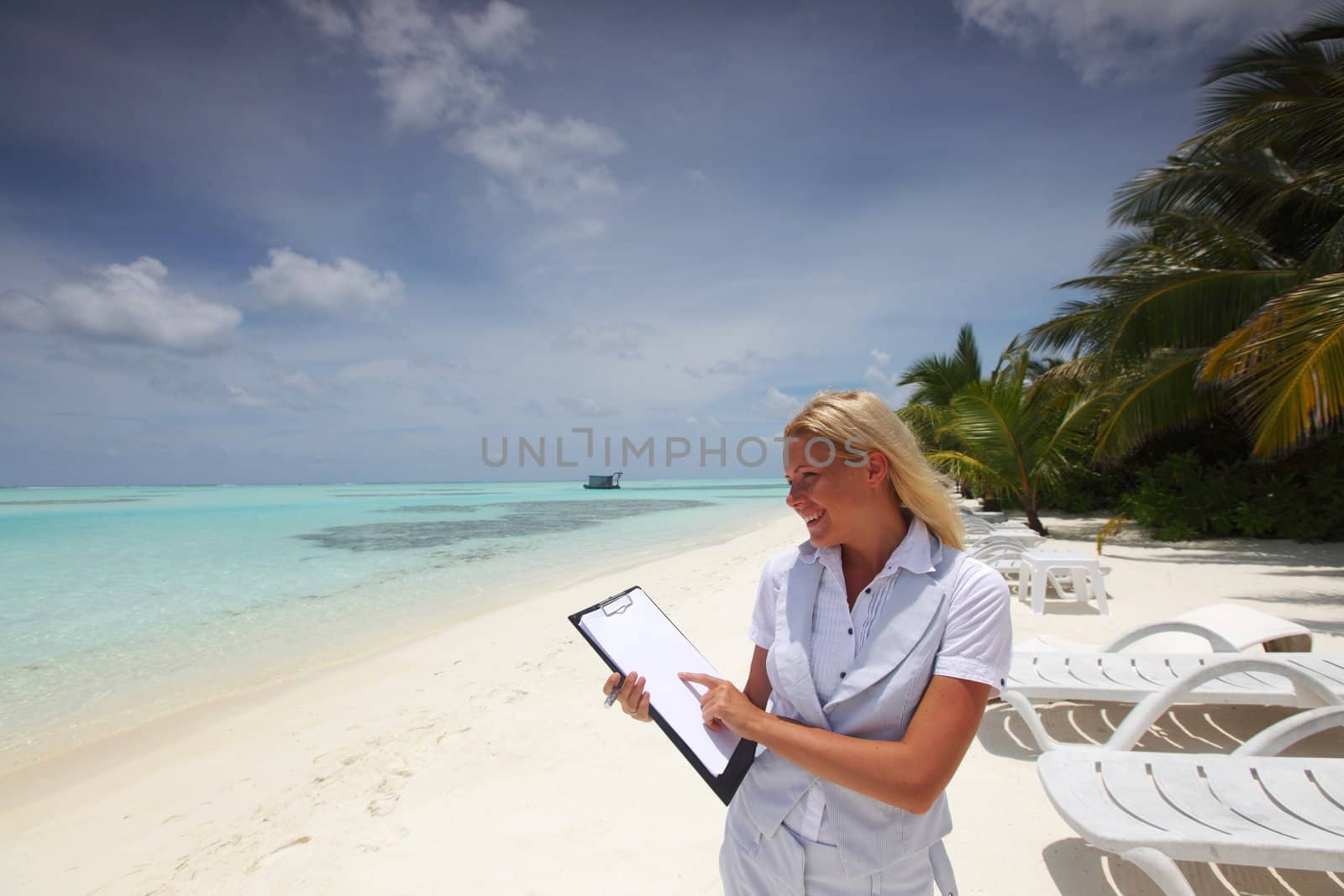 business woman with blank paper on the desolate ocean coast