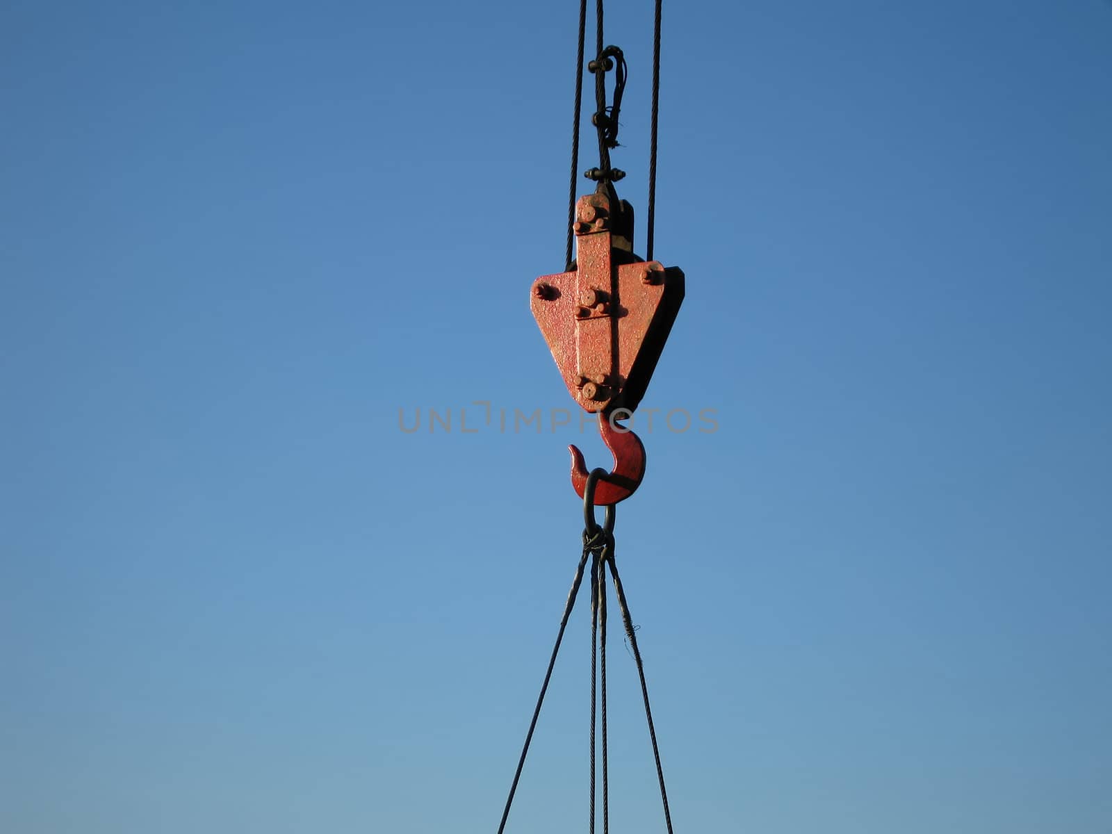 Hook of building crane lifting cargo by ia_64