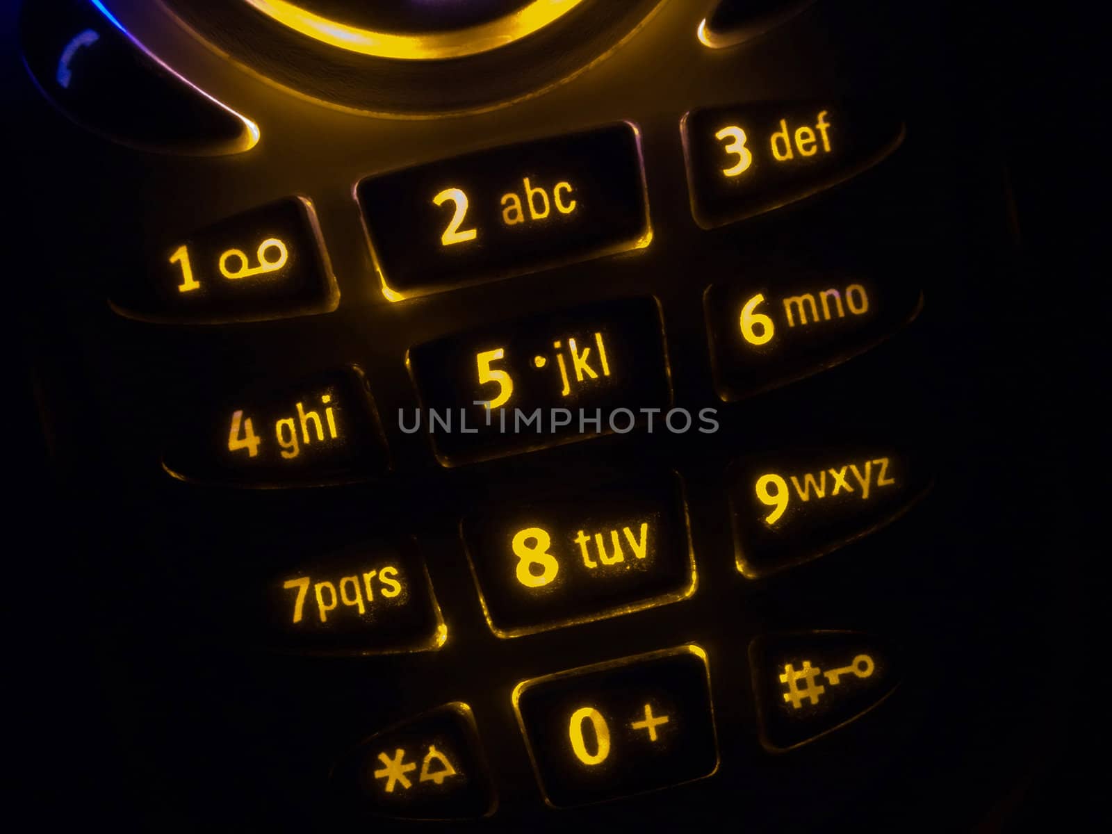 Mobile phone keypad back lit macro image on black